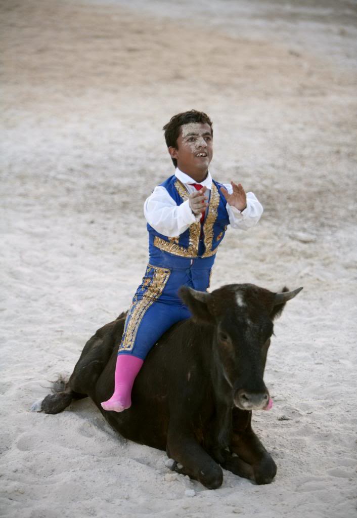 108788-dwarf-bullfighter-jorge-vega-from-los-enanitos-toreros-sits-on-a-calf-_zpsb80c40b8.jpg