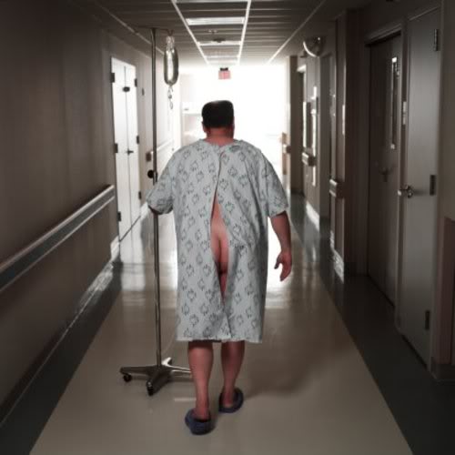 a_patient_in_hospital_gown_walking_with__1.jpg