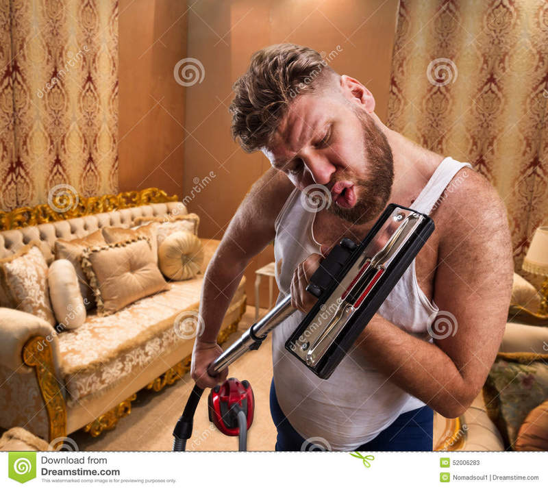 bizarre-man-sings-to-vacuum-cleaner-beard-home-interior-52006283.jpg