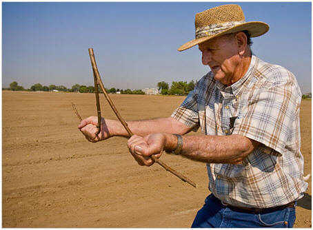 farmer dowsing for water.jpg
