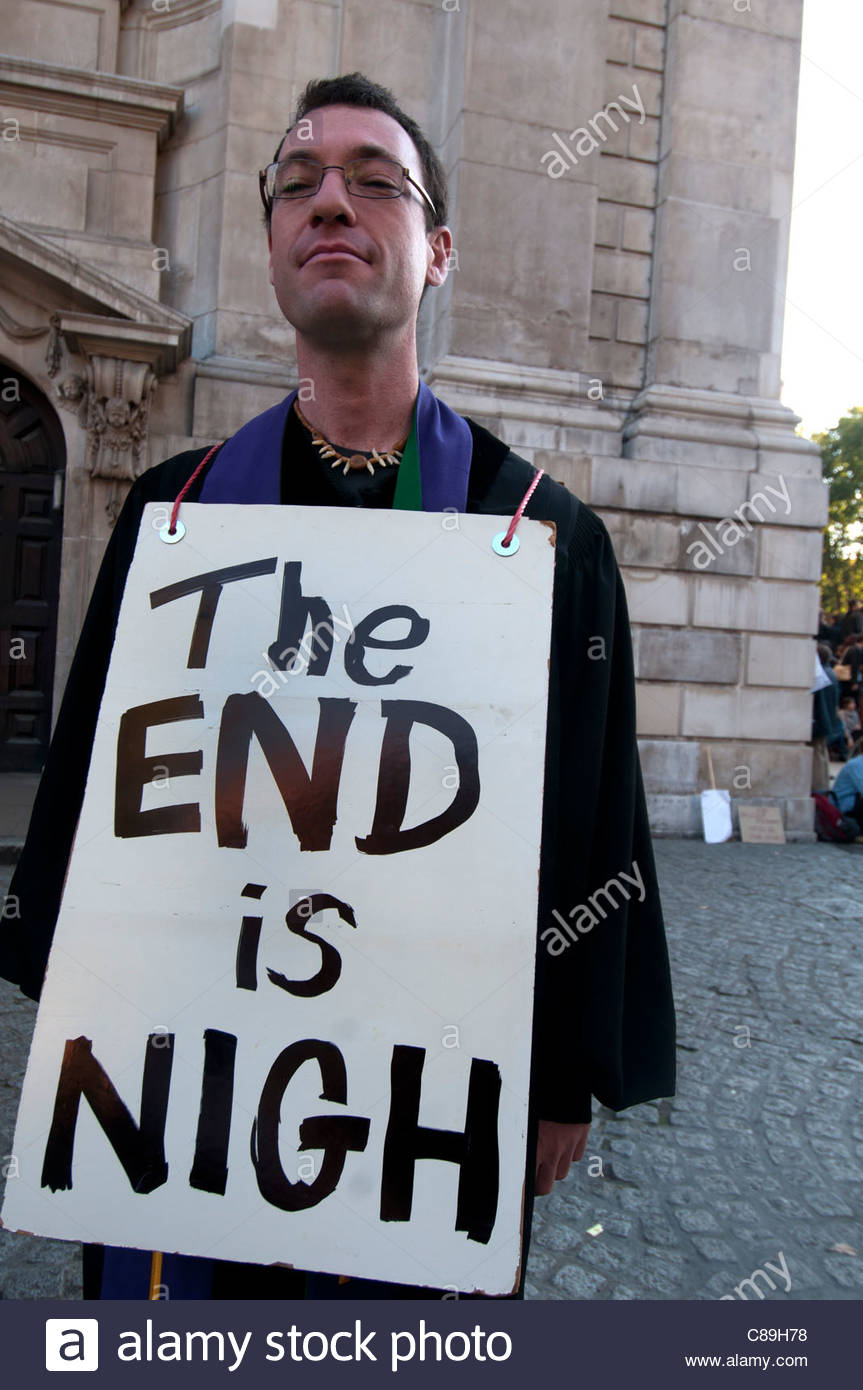 occupy-london-man-with-sandwich-boards-saying-the-end-is-nigh-in-front-C89H78.jpg